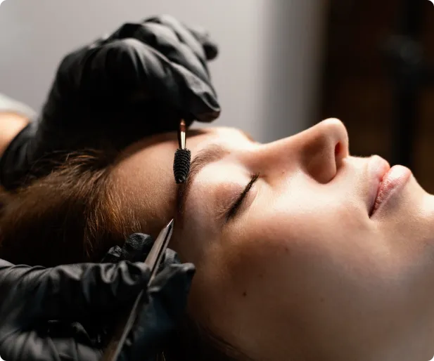 Artist Nancy Lin microblading a female client